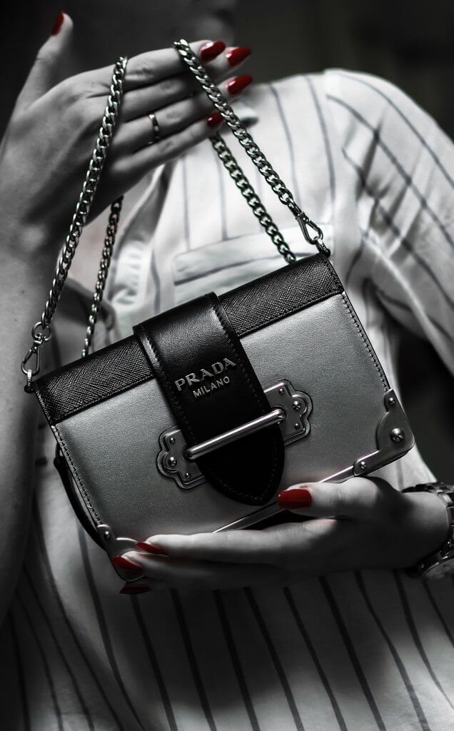 Woman Holding Prada Handbag